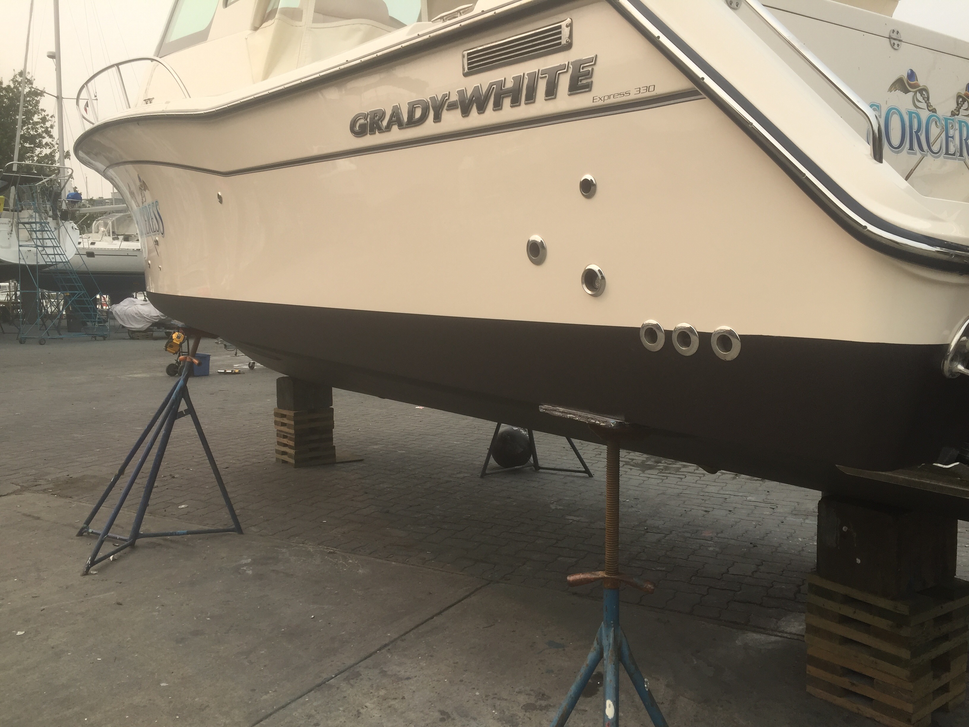 Onsite mobile boat maintenance and antifouling bottom paint at Granville Island Vancouver BC by MRV Marine Services.
