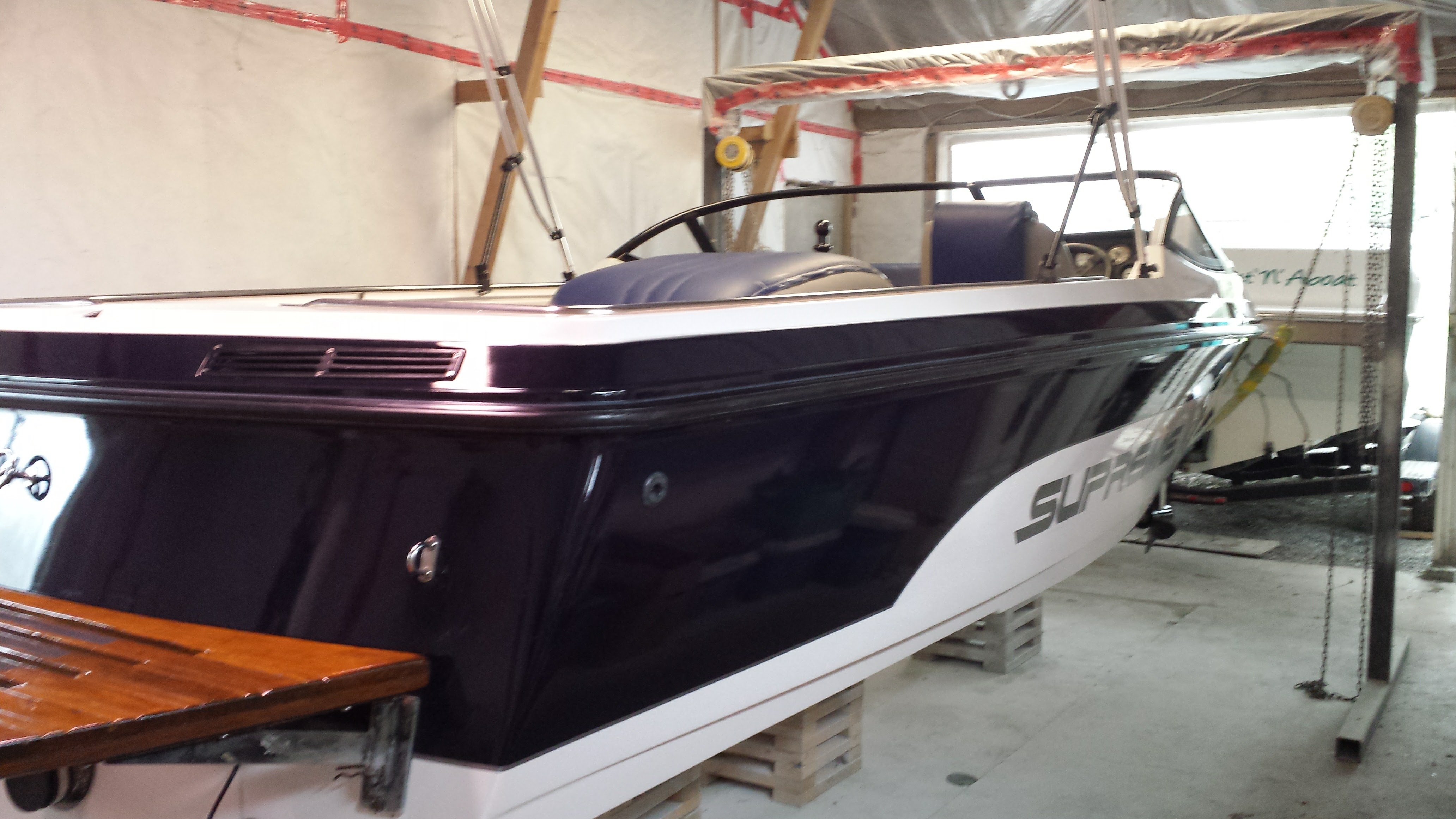 Ski Supreme boat exterior refinishing including a new hull paint job, swim platform varnishing and detailing for a Aldergrove / Langley BC customer from MRV Marine Services.